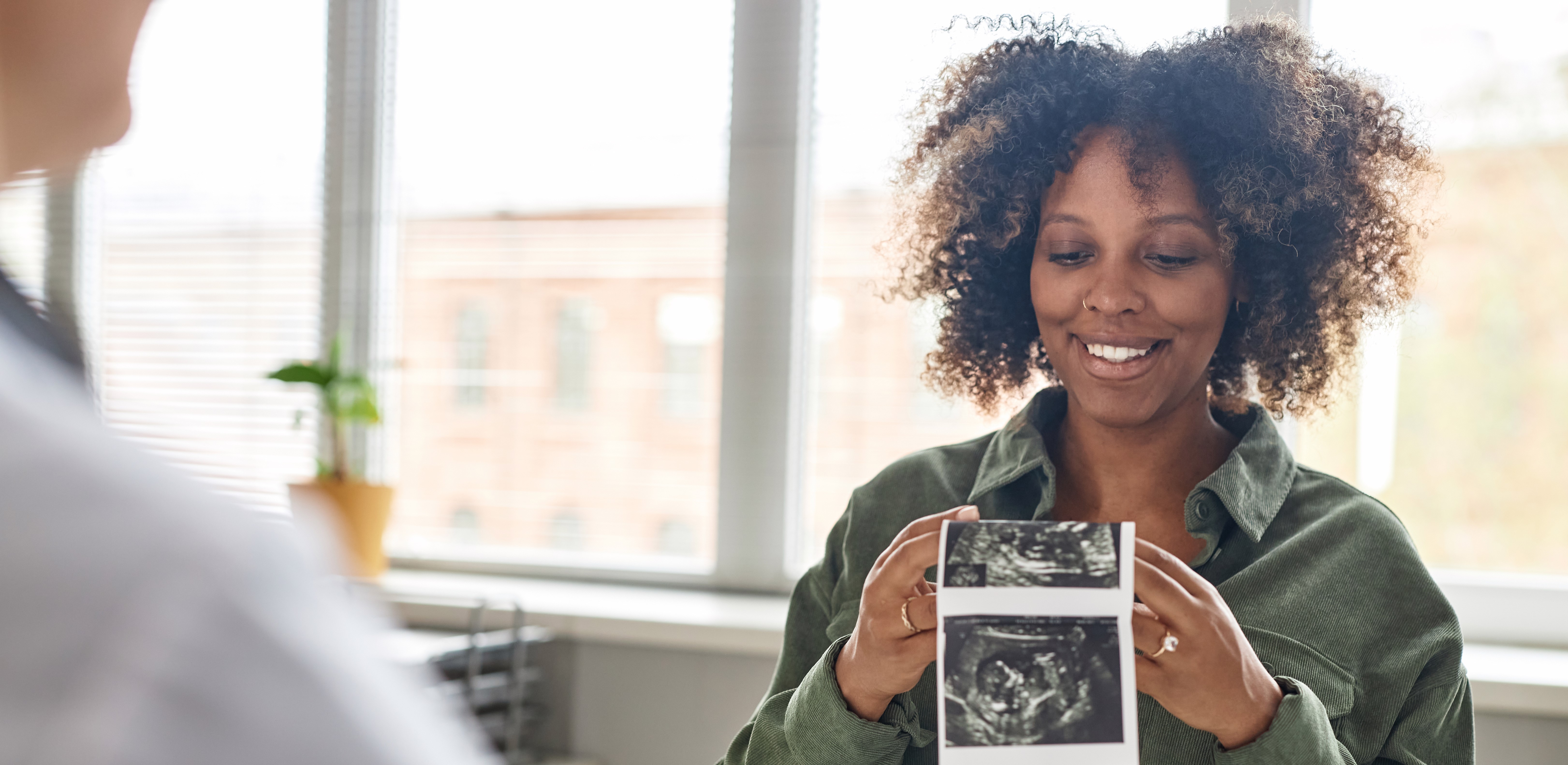 patient looking at ultrasound images